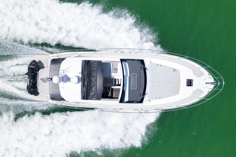Slide: The Image of Aerial view of 2021 Azimut Atlantis 45 yacht cruising on green water. - 2