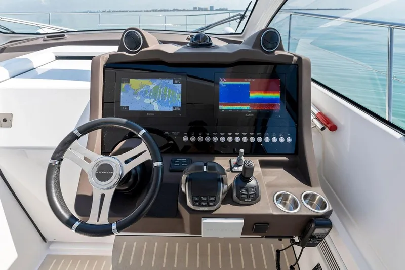 Slide: The Image of Cockpit of 2021 Azimut Atlantis 45 yacht with navigation screens and steering wheel. - 22