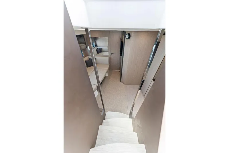 Slide: The Image of Interior view of 2021 Azimut Atlantis 45 yacht, featuring modern stairs and cozy seating area. - 23