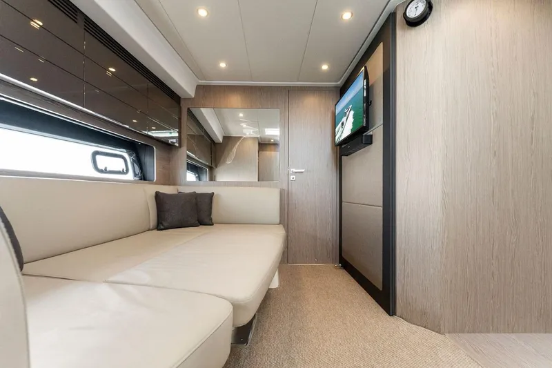 Slide: The Image of Luxurious interior of 2021 Azimut Atlantis 45 yacht with modern seating and wall-mounted TV. - 25