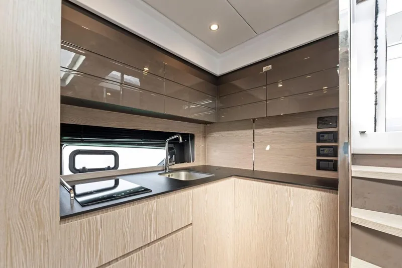 Slide: The Image of Modern kitchen interior of 2021 Azimut Atlantis 45 yacht with sleek cabinetry and appliances. - 27