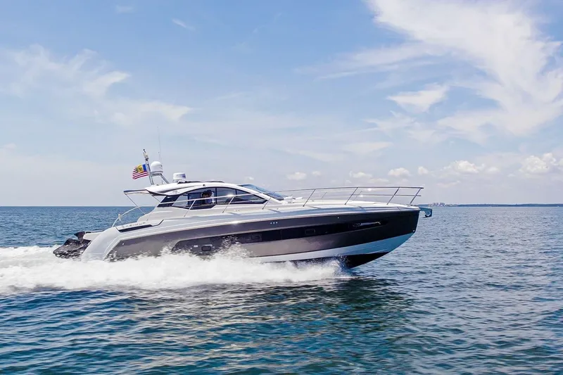 Slide: The Image of 2021 Azimut Atlantis 45 yacht cruising on open water under a clear sky. - 3