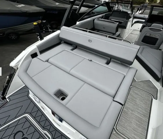 Slide: The Image of Luxurious 2025 Cobalt R4 boat with gray upholstery and modern design. - 4