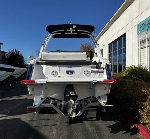 Slide: The Image of Rear view of a 2025 Cobalt R4 boat outdoors. - 4
