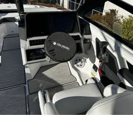Slide: The Image of Interior of a 2025 Cobalt R4 boat with modern controls. - 7