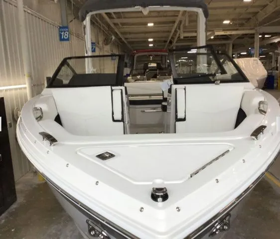 Slide: The Image of 2025 Cobalt R6 Surf boat in showroom, front view. - 3
