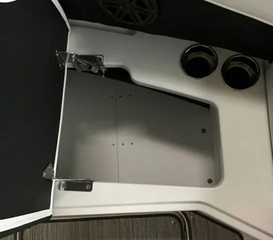 Slide: The Image of Interior of 2025 Cobalt R6 Surf with storage and cup holders. - 7