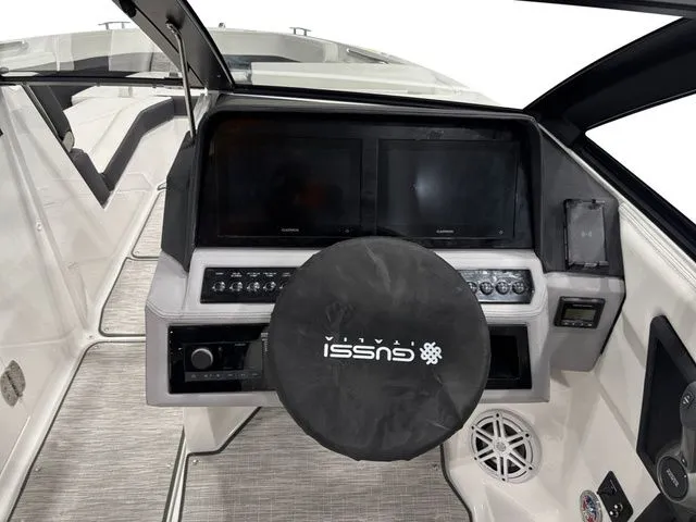 Slide: The Image of Interior view of 2025 Cobalt R6 boat cockpit with modern controls. - 13