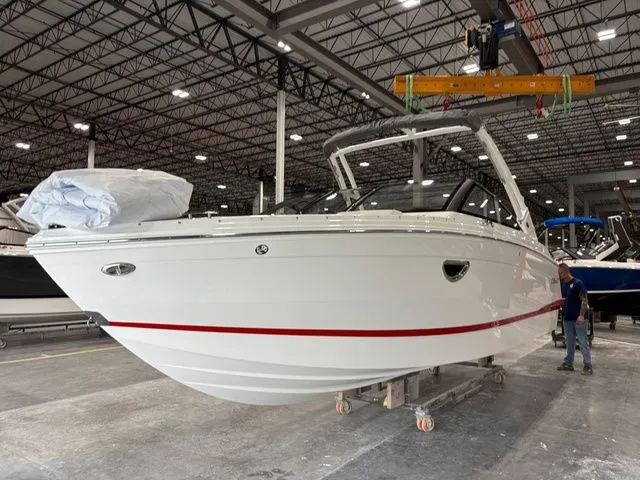 Slide: The Image of 2025 Cobalt R6 boat in warehouse, side view. - 15