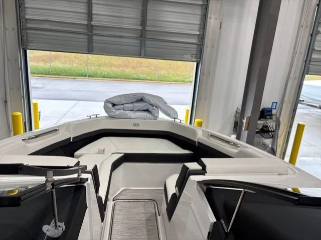 Slide: The Image of Interior view of a 2025 Cobalt R6 boat in a garage. - 17