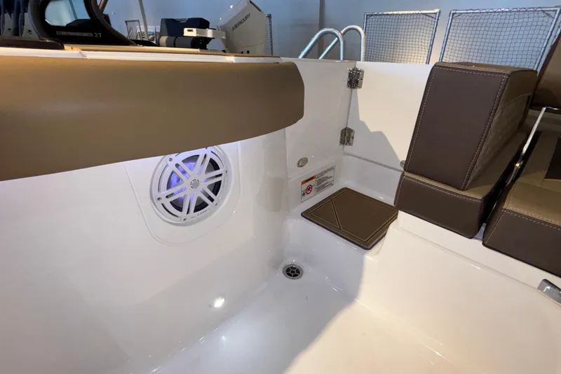Slide: The Image of Interior of 2026 Monterey Elite 30 OB boat with seating and speaker. - 10