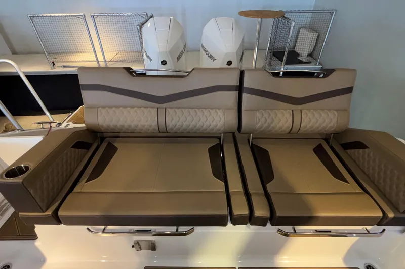 Slide: The Image of Luxury seating on 2026 Monterey Elite 30 OB boat with dual Mercury engines. - 11