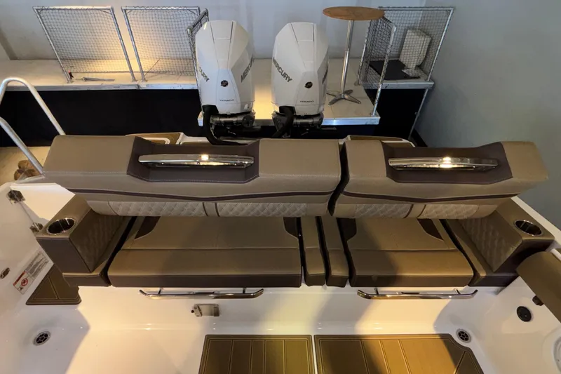 Slide: The Image of 2026 Monterey Elite 30 OB boat interior with dual Mercury engines and luxurious seating. - 12