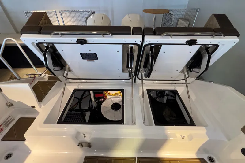 Slide: The Image of Open engine compartments of a 2026 Monterey Elite 30 OB boat. - 15