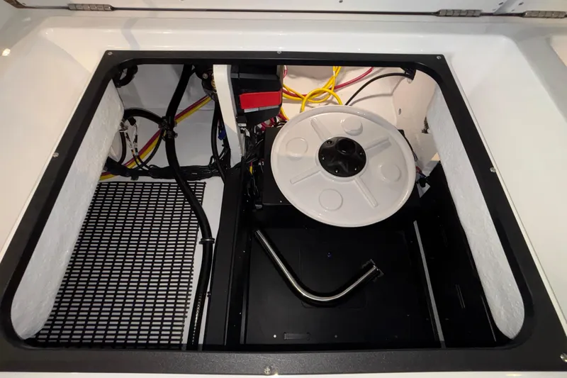 Slide: The Image of Engine compartment of 2026 Monterey Elite 30 OB boat, showcasing wiring and components. - 16