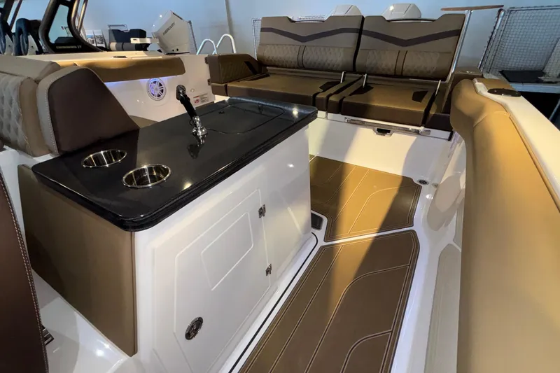 Slide: The Image of Luxurious interior of 2026 Monterey Elite 30 OB boat with sleek seating and modern amenities. - 20