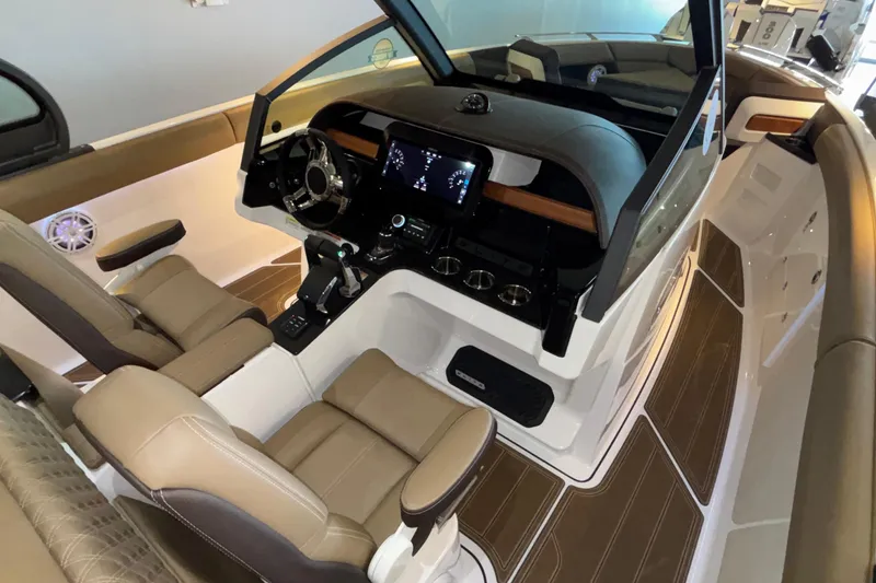 Slide: The Image of 2026 Monterey Elite 30 OB boat interior with modern dashboard and luxurious seating. - 28