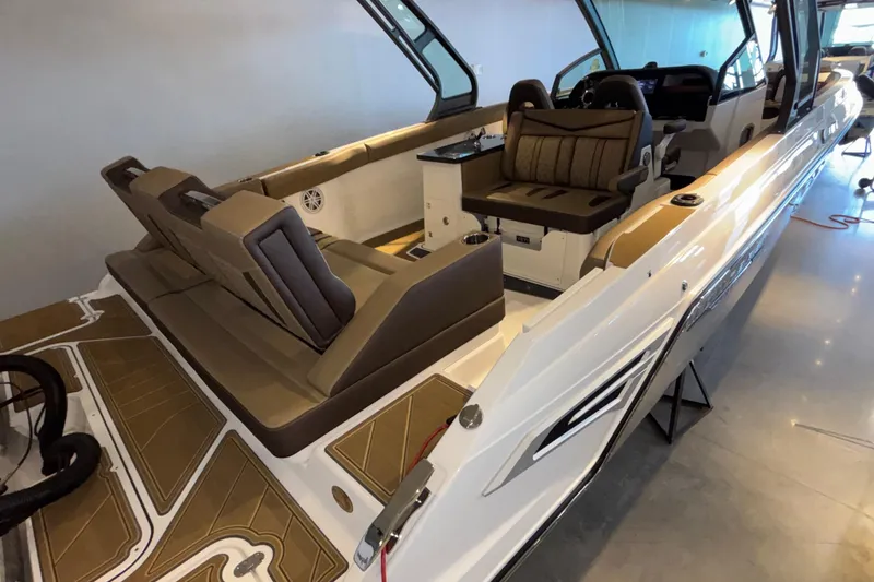 Slide: The Image of 2026 Monterey Elite 30 OB boat interior with luxurious seating and modern design. - 3