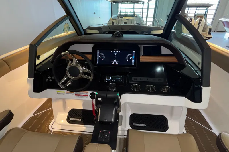 Slide: The Image of 2026 Monterey Elite 30 OB boat dashboard with modern controls and sleek design. - 30