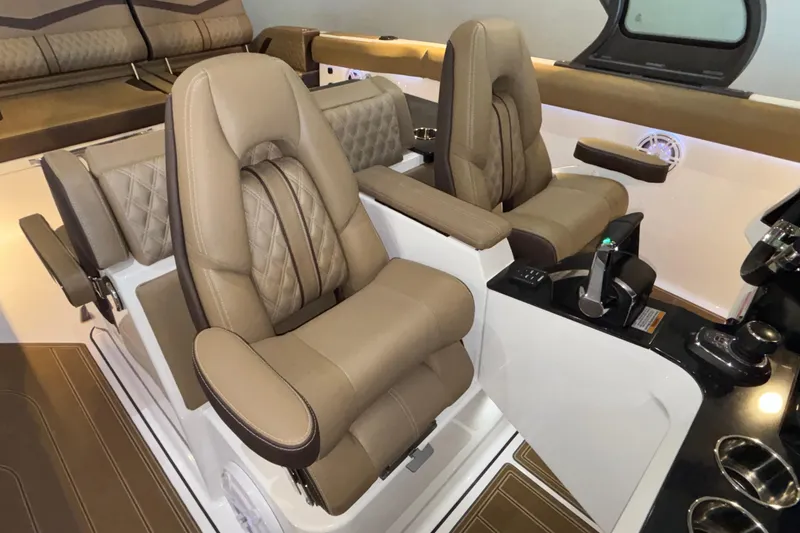 Slide: The Image of Luxurious interior of 2026 Monterey Elite 30 OB boat with plush seating. - 32