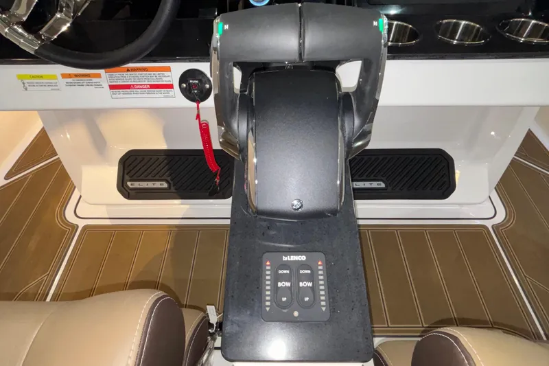 Slide: The Image of 2026 Monterey Elite 30 OB boat cockpit with control panel and steering wheel. - 33