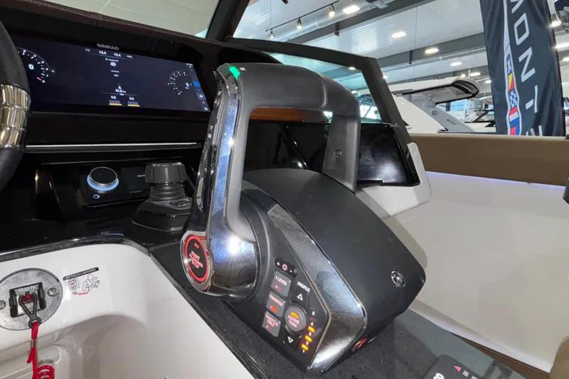 Slide: The Image of Control panel of 2026 Monterey Elite 30 OB boat with advanced navigation system. - 34
