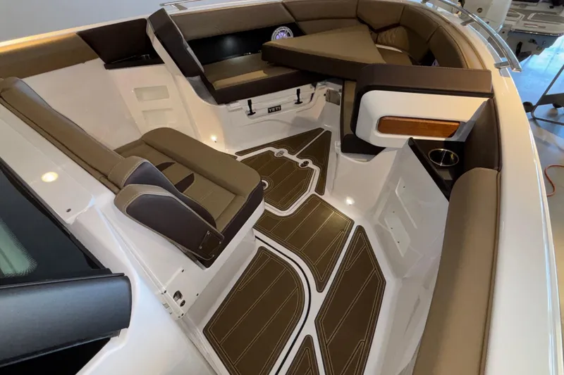 Slide: The Image of Luxurious interior of 2026 Monterey Elite 30 OB boat with stylish seating and flooring. - 38