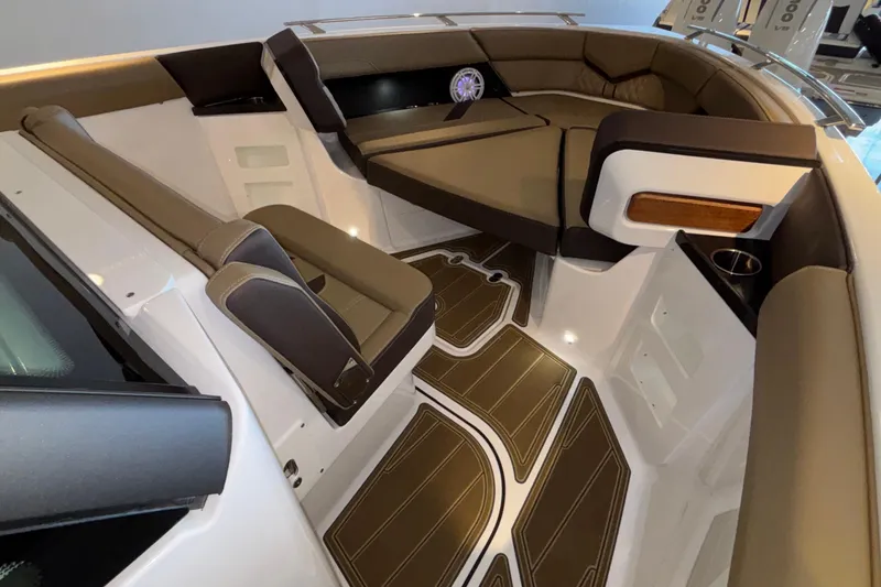 Slide: The Image of 2026 Monterey Elite 30 OB boat interior with luxurious seating and stylish flooring. - 39