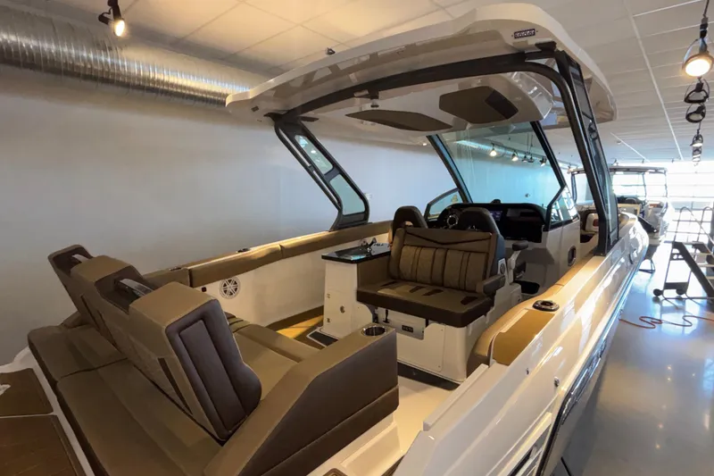 Slide: The Image of 2026 Monterey Elite 30 OB boat interior with luxurious seating and modern design. - 4