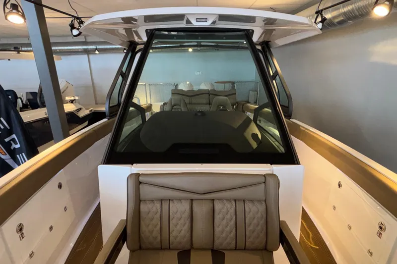 Slide: The Image of 2026 Monterey Elite 30 OB boat interior with luxurious seating and modern design. - 41