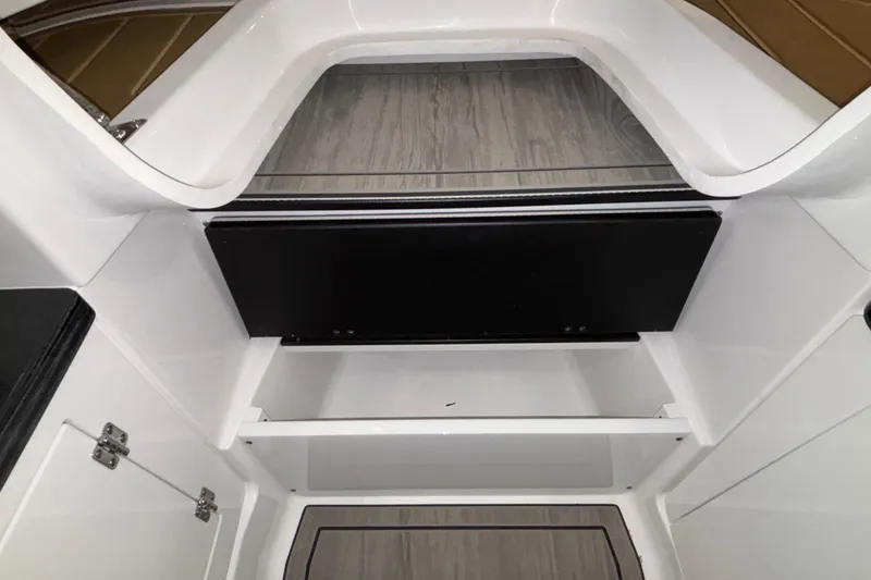 Slide: The Image of Interior view of 2026 Monterey Elite 30 OB boat, featuring sleek white and black design. - 60
