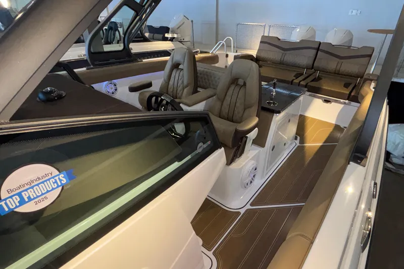 Slide: The Image of 2026 Monterey Elite 30 OB boat interior with luxurious seating and modern dashboard. - 67
