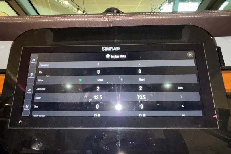 Slide: The Image of Simrad engine data display on 2026 Monterey Elite 30 OB boat dashboard. - 7