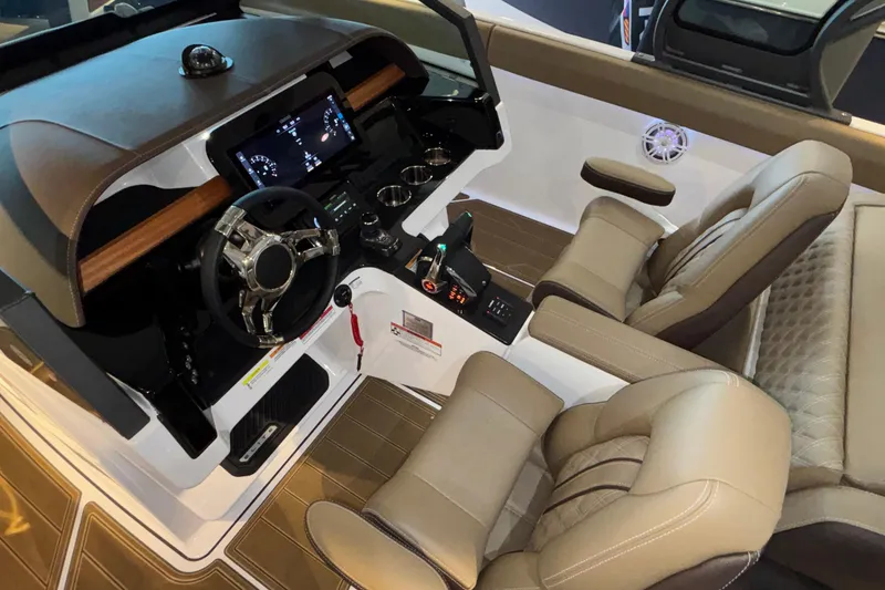 Slide: The Image of Luxurious cockpit of 2026 Monterey Elite 30 OB with modern steering and plush seating. - 70