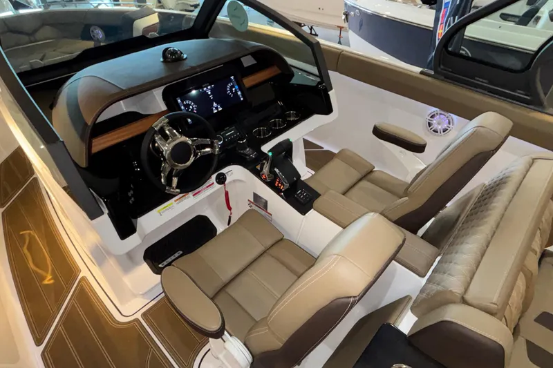 Slide: The Image of Interior of 2026 Monterey Elite 30 OB boat with modern dashboard and seating. - 71