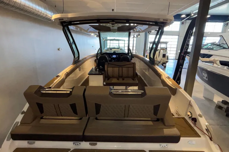 Slide: The Image of 2026 Monterey Elite 30 OB boat interior with luxurious seating and modern design. - 76