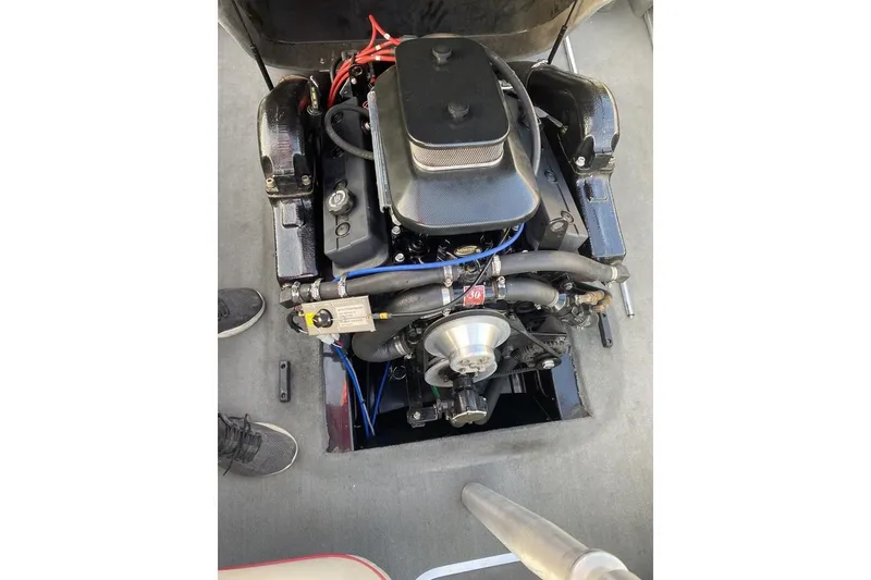 Slide: The Image of 2002 Malibu Response LX engine compartment with visible components and wiring. - 9