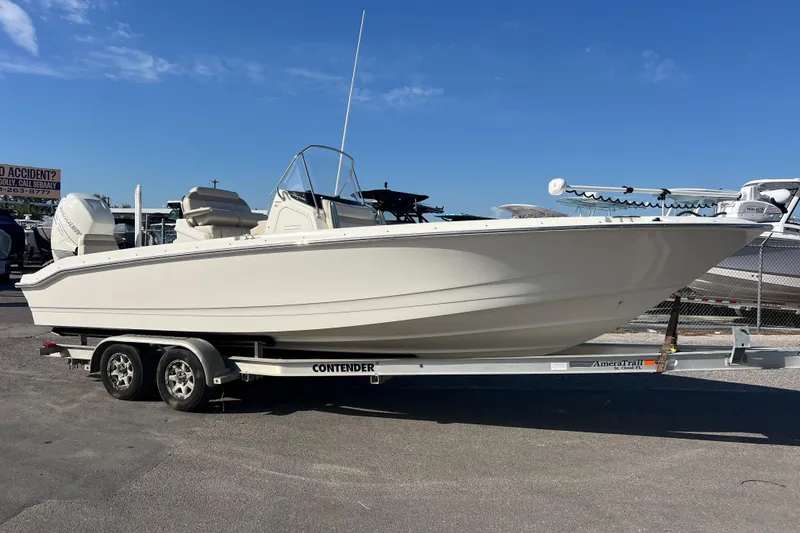 The Image of 2021 Boston Whaler 250 Dauntless boat on trailer under clear blue sky. - 0