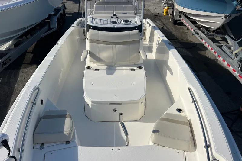 Slide: The Image of 2021 Boston Whaler 250 Dauntless boat interior with seating and storage compartments. - 13