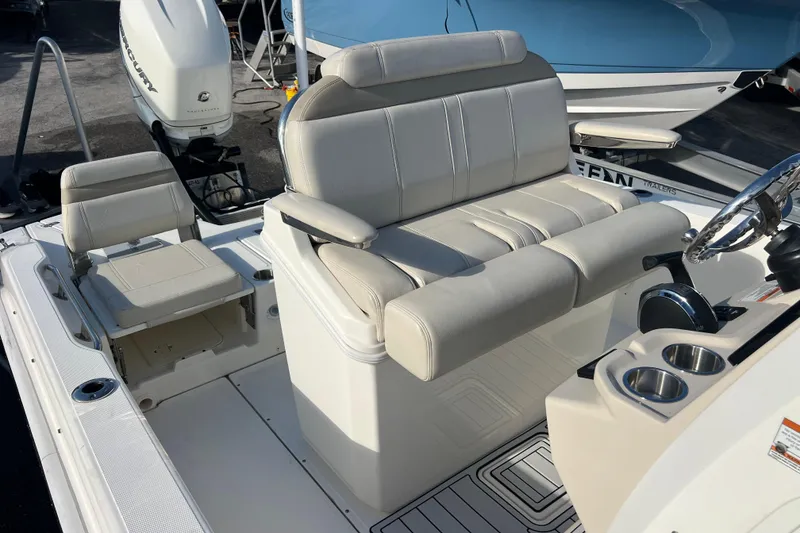 Slide: The Image of 2021 Boston Whaler 250 Dauntless boat interior with seating and steering console. - 17