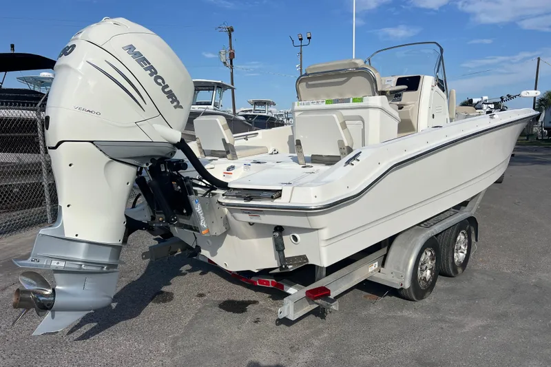Slide: The Image of 2021 Boston Whaler 250 Dauntless boat on trailer with Mercury engine. - 4