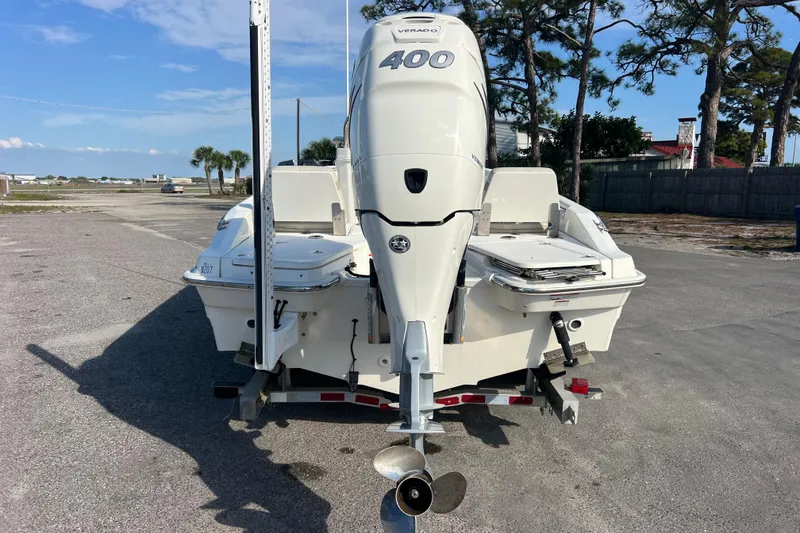 Slide: The Image of 2021 Boston Whaler 250 Dauntless boat with powerful 400 Verado engine, parked outdoors. - 5