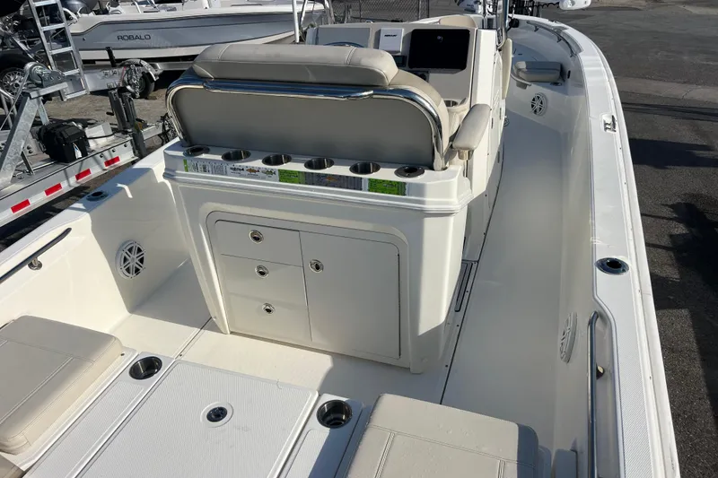 Slide: The Image of 2021 Boston Whaler 250 Dauntless boat interior with seating and storage compartments. - 7