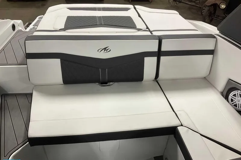 Slide: The Image of 2023 Monterey 238SS Super Sport boat interior with sleek white and black seating. - 2