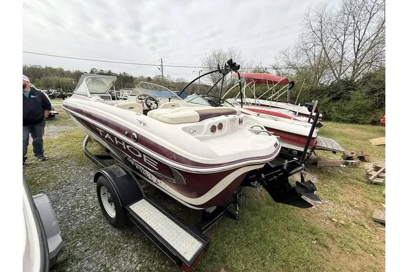 Slide: The Image of 2009 Tahoe Q4 SF boat on trailer, parked outdoors. - 4