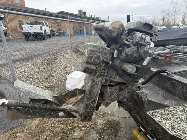 Slide: The Image of Camouflage motor of Excel 1954 DGB boat, year 2020, in a parking lot. - 8