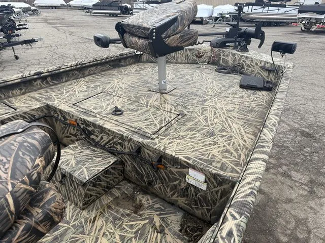 Slide: The Image of 2022 Lowe 1860 ROUGHNECK SC boat with camouflage pattern on parking lot. - 4