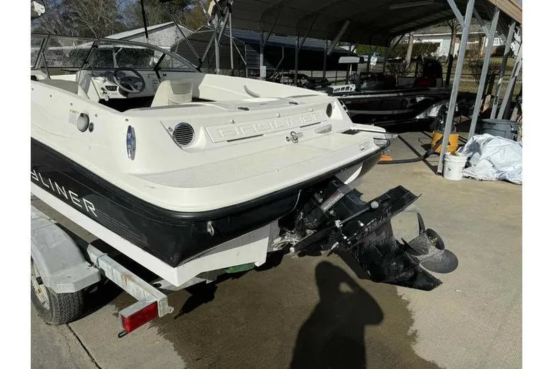 Slide: The Image of 2012 Bayliner 175 Bowrider on trailer, parked outdoors under a canopy. - 8
