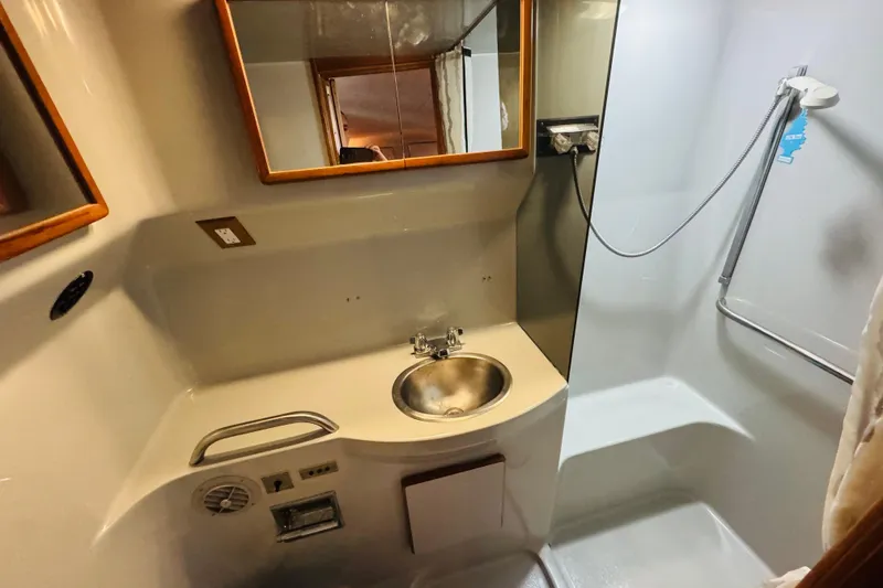 Slide: The Image of Bathroom interior of 1991 Sea Ray 380 Aft Cabin yacht with sink and shower. - 34