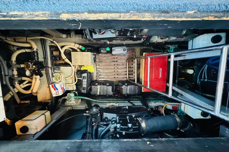 Slide: The Image of Engine room of a 1991 Sea Ray 380 Aft Cabin boat, showcasing mechanical components. - 41
